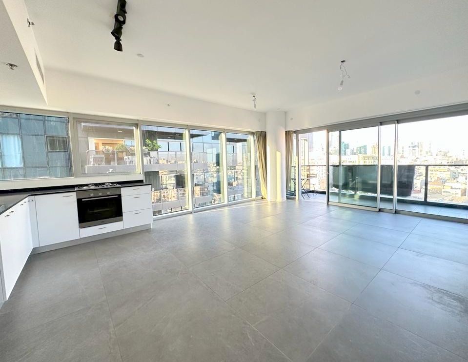 Open-plan living area and kitchen in ICE Tel Aviv apartment