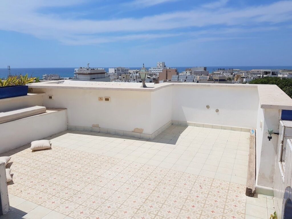 Stunning 3-room duplex apartment with a private rooftop in the Old North of Tel Aviv, featuring panoramic city and sea views.