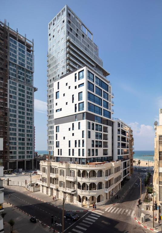 Iconic 1930s Renoma building in Tel Aviv near the Mediterranean, blending historic charm with modern design