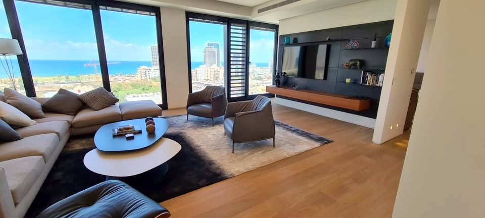 Spacious living area in White City Tower apartment with sea views.