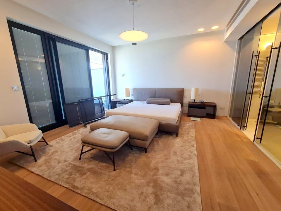 Master bedroom in White City Tower apartment with modern furnishings.