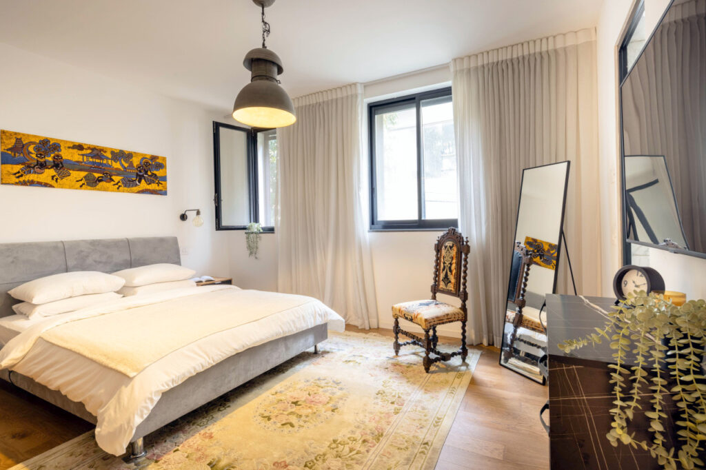 Bright and stylish bedroom in Tel Aviv short term rental with classic décor