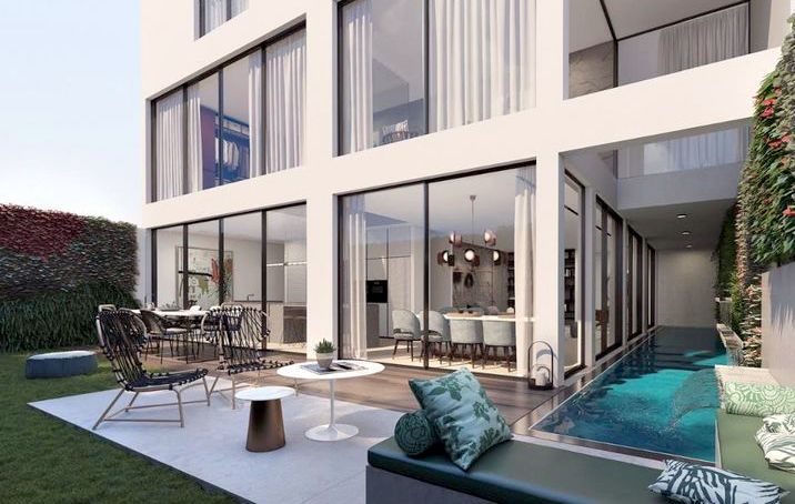 Private garden with seating area and swimming pool in luxury Rothschild apartment