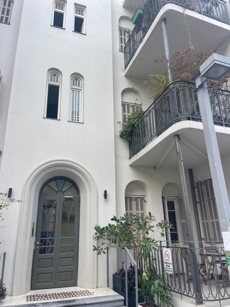 Restored historic building with arched entrance in Tel Aviv