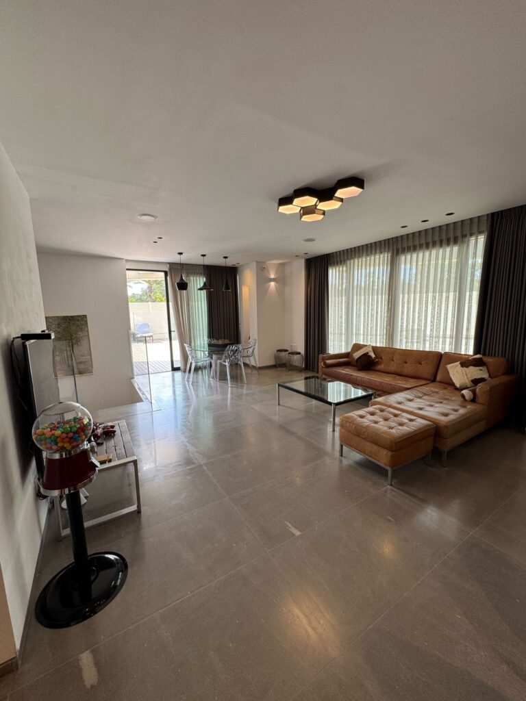 Spacious living room with natural light in Tel Aviv luxury apartment