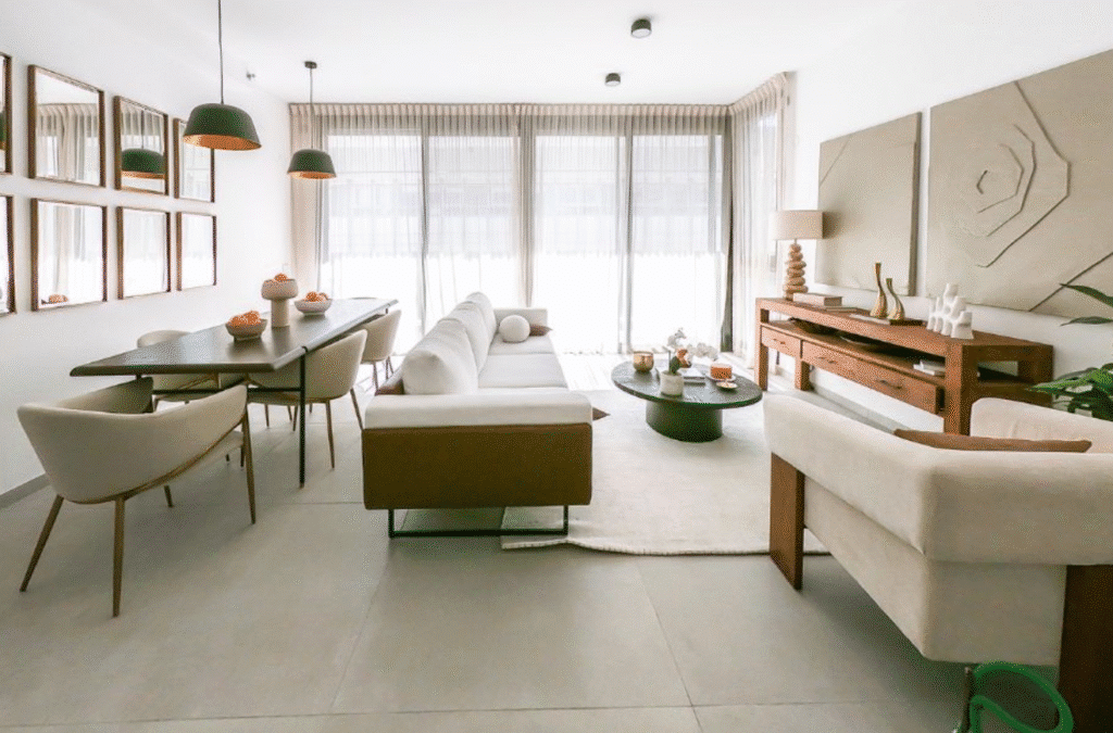 Stylish living room with floor-to-ceiling windows in Tel Aviv apartment for sale