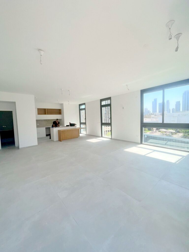Open-plan kitchen and living space in new apartment, Tel Aviv