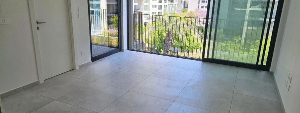 Open interior space with floor-to-ceiling glass doors