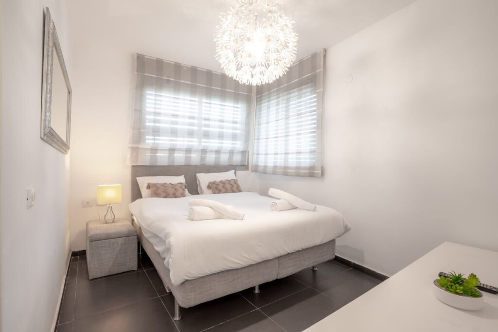 Bright bedroom with elegant decor in beachfront Tel Aviv apartment