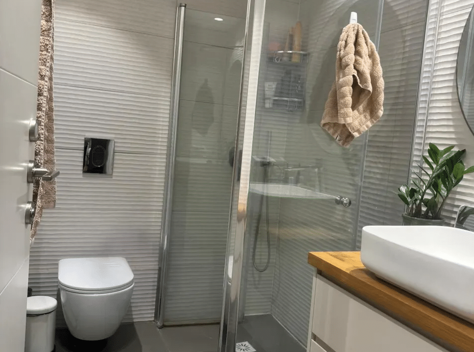 Contemporary bathroom with glass shower and modern sink design