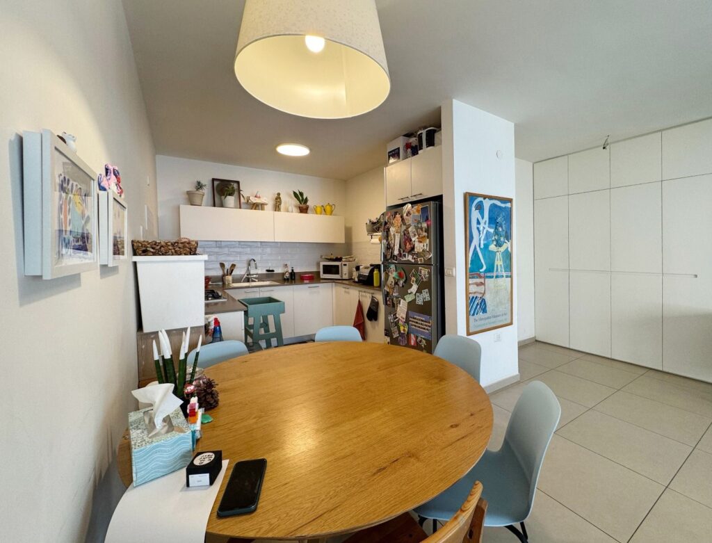 Modern kitchen and dining area with built-in storage