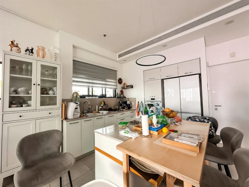 Contemporary kitchen with central dining island