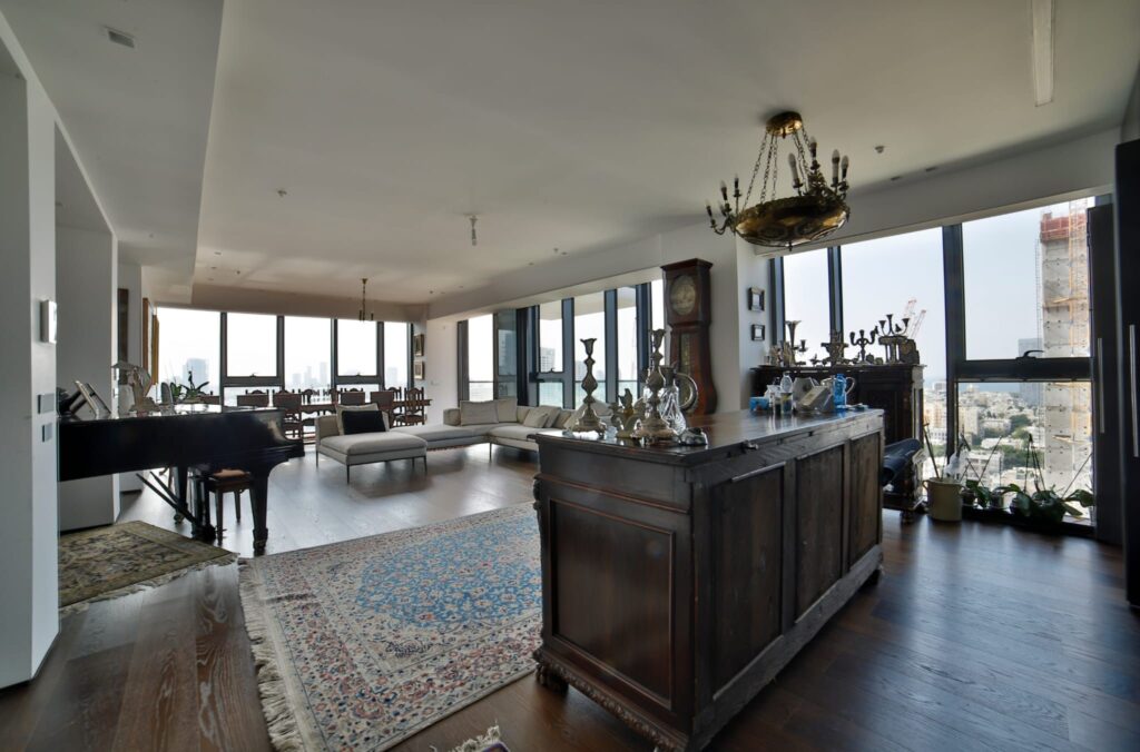 Spacious living room with large windows and natural light