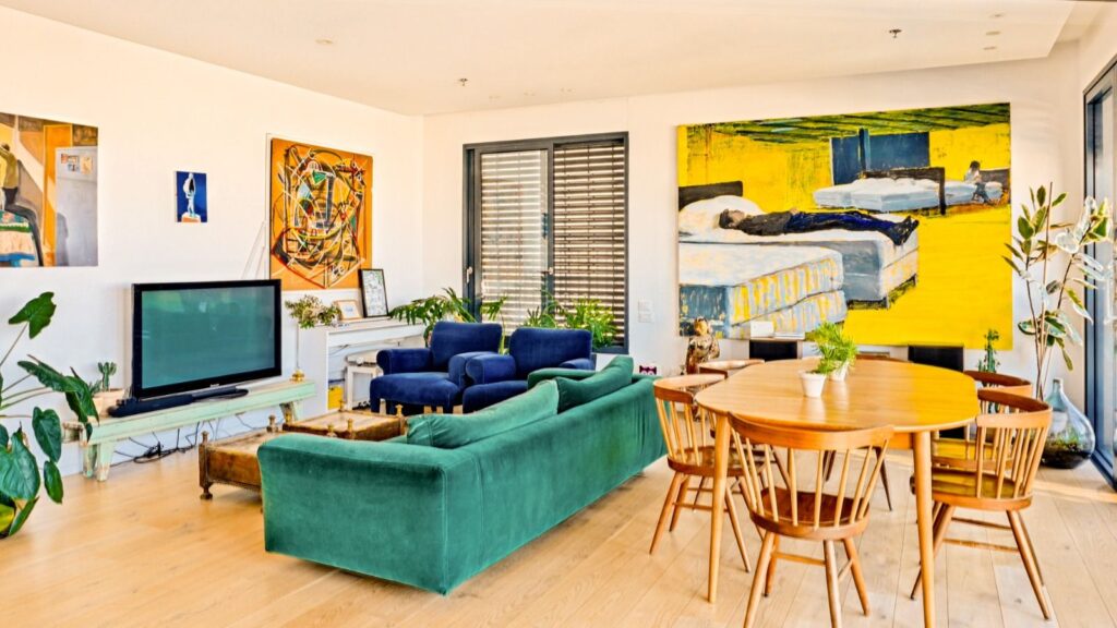Artistic living room with bright modern furniture in Tel Aviv penthouse