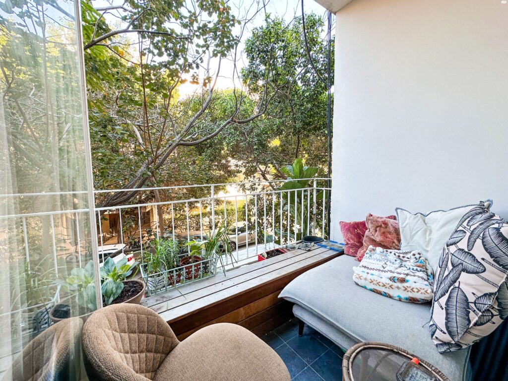 Balcony with lounge seating in Tel Aviv city center apartment