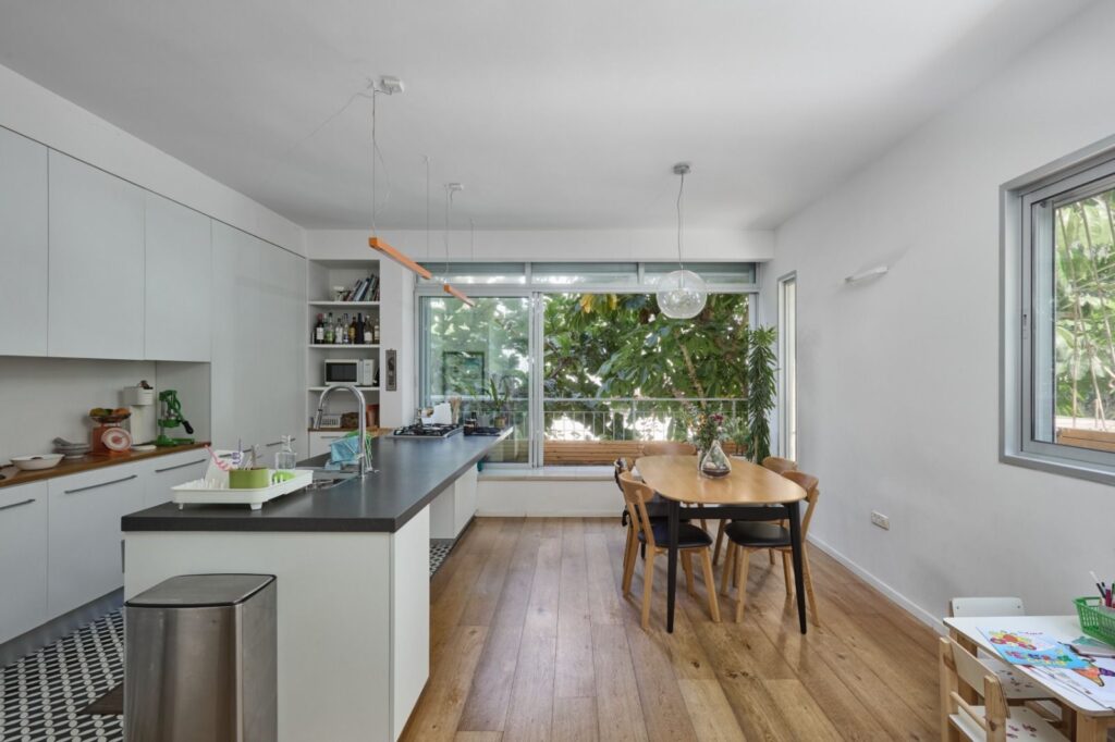 Renovated kitchen and dining area with garden view – Gordon Street Tel Aviv