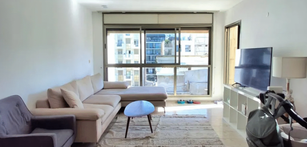 Bright Tel Aviv living room with large windows and natural light
