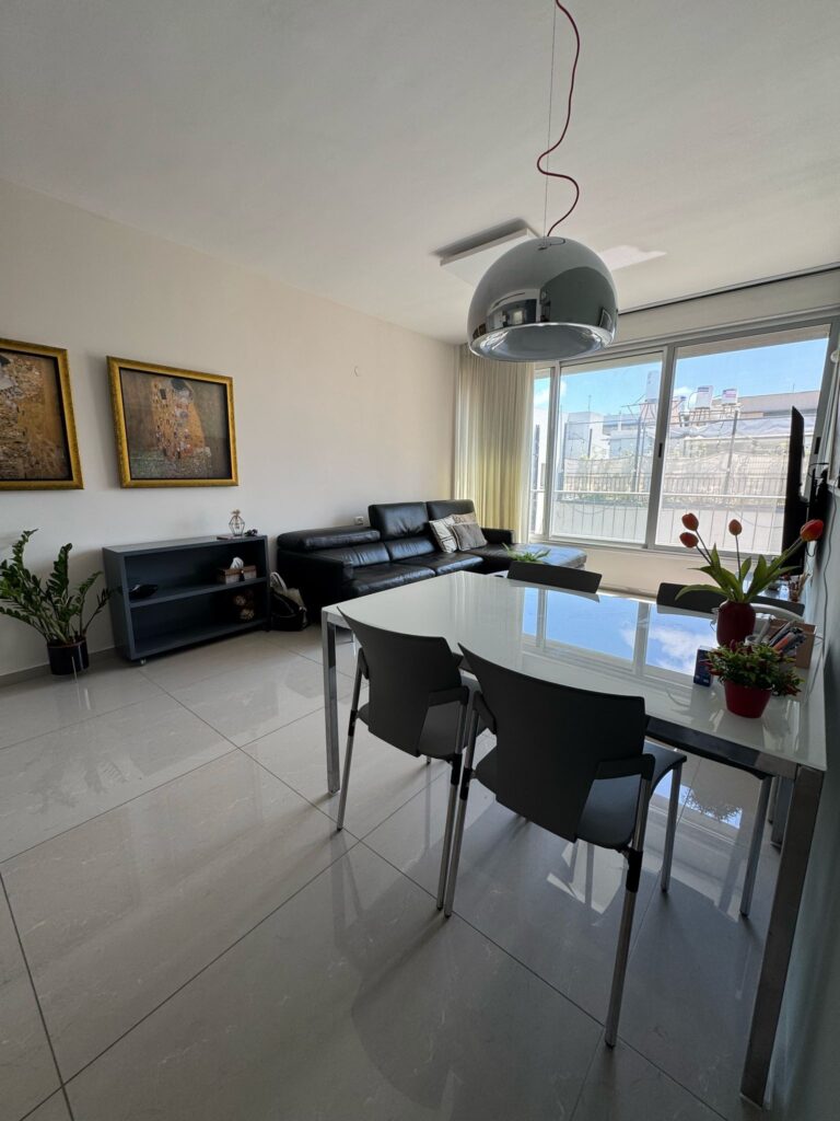 Dining area with natural light and balcony view