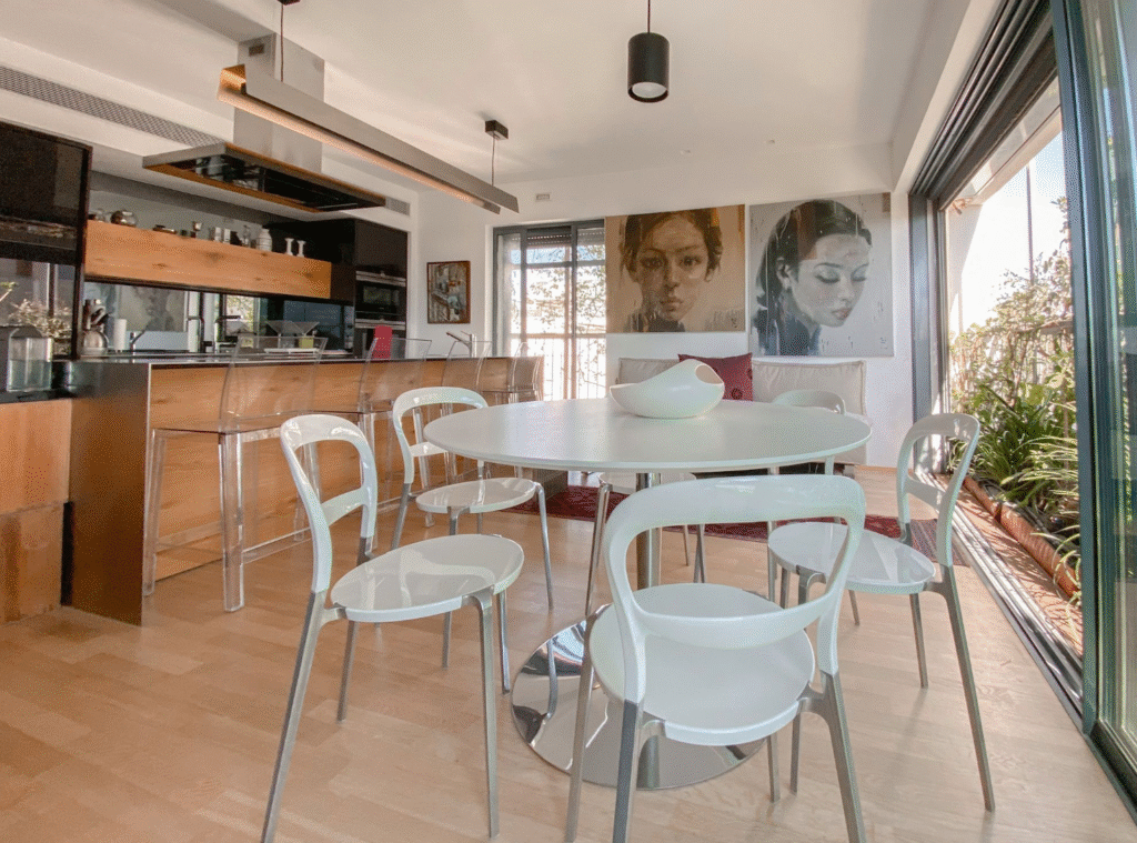 Designer kitchen and dining space in renovated Tel Aviv apartment