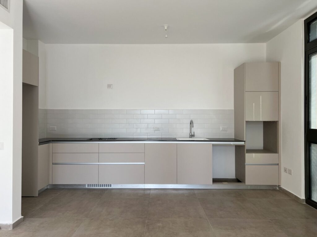Sleek modern kitchen in boutique building Tel Aviv