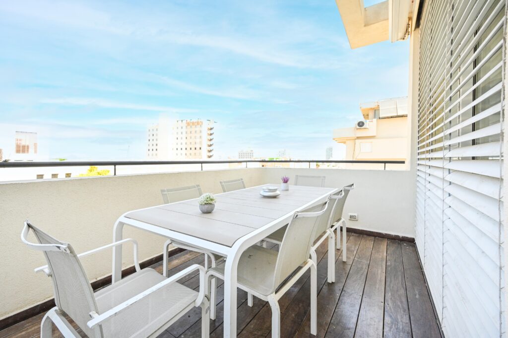 Private outdoor dining terrace with Tel Aviv skyline view