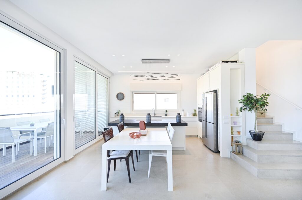Bright open-plan kitchen and dining area with luxury finishes