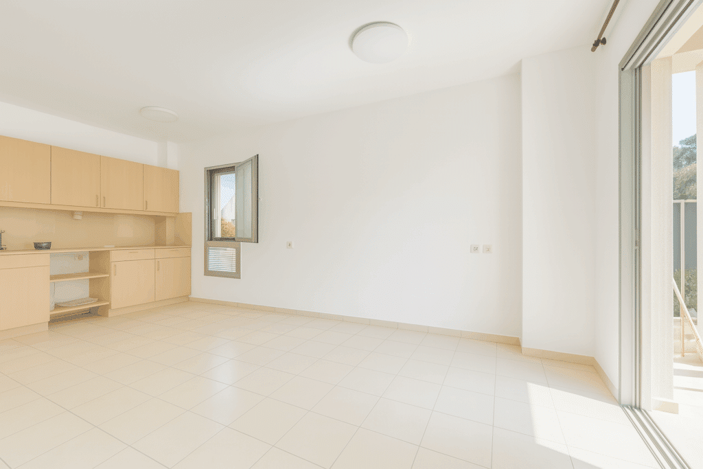 Open-plan living space with kitchen in apartment for sale on Dizengoff Street