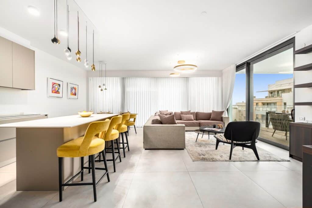 Modern living room and kitchen in luxury Tel Aviv apartment