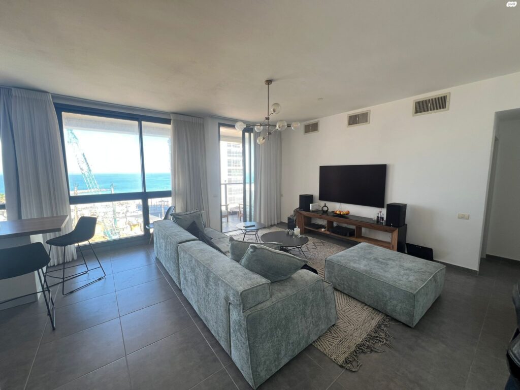 Modern living room with sea view in Tel Aviv apartment