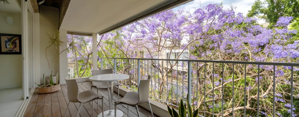 Large private balcony surrounded by greenery