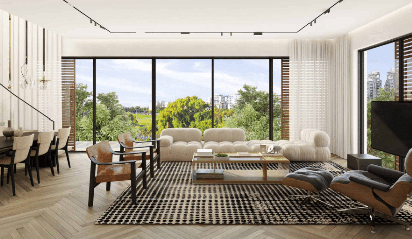 Spacious modern living room with floor-to-ceiling park views in Tel Aviv penthouse