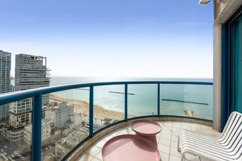 Private balcony overlooking Tel Aviv beach and skyline
