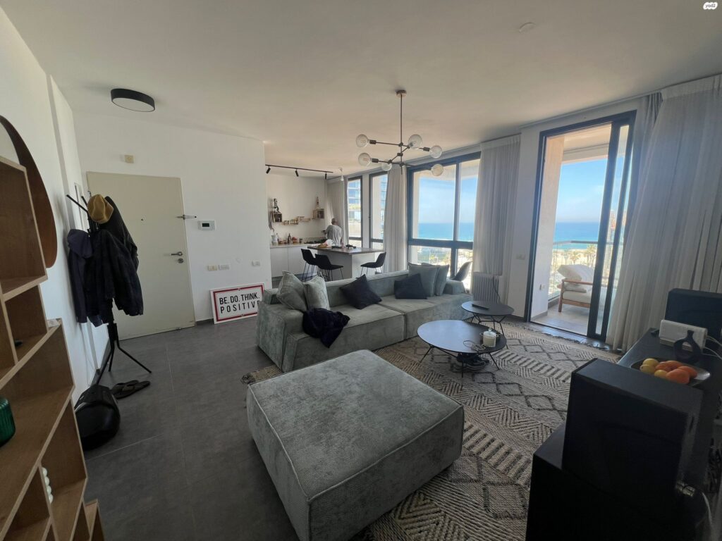 Spacious open-plan living room in sea view Tel Aviv apartment