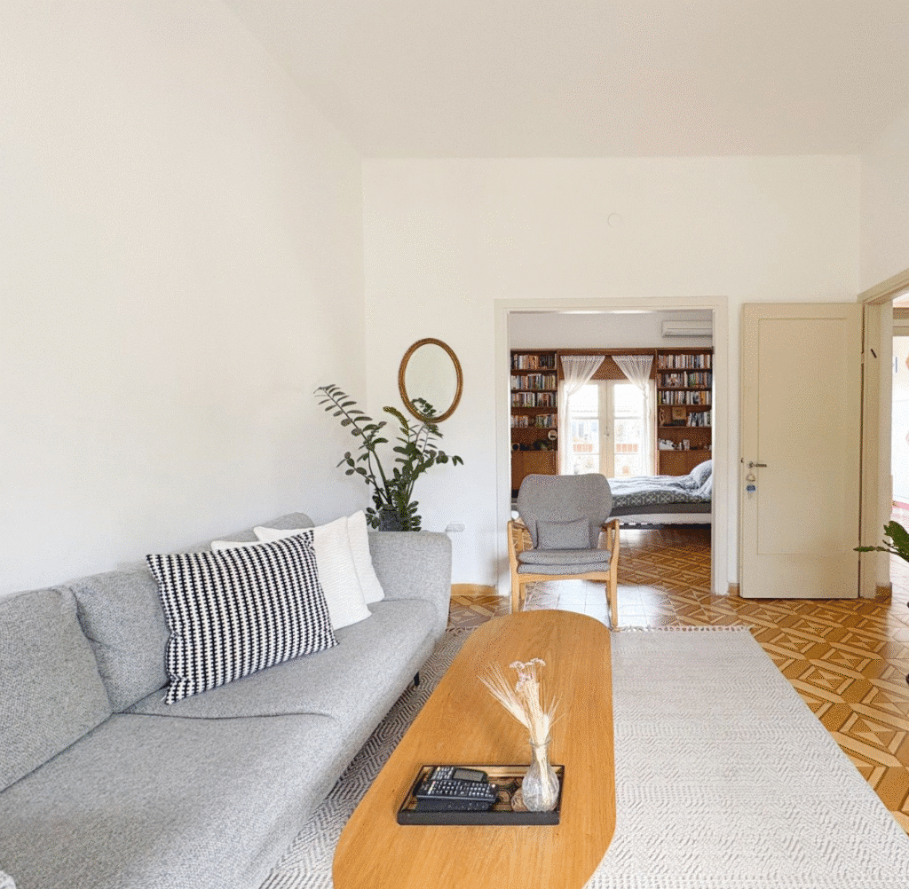 Bright living room with gray sofa and natural wood decor