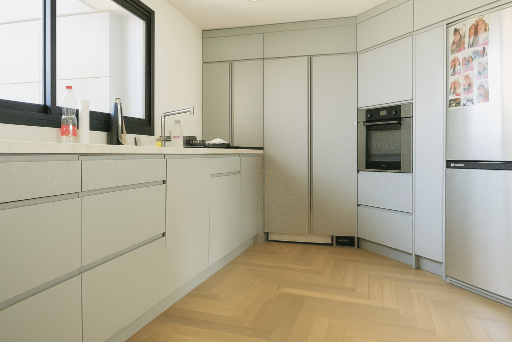Minimalist kitchen with integrated appliances in luxury Sea & Sun rental