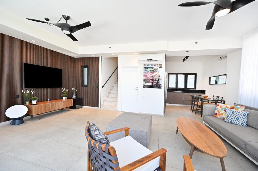 Modern living room with wood accents in Tel Aviv apartment