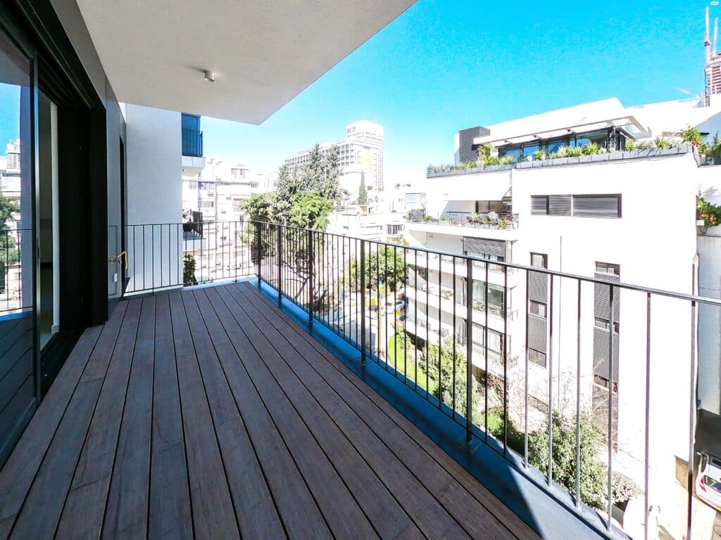 Spacious sun terrace with open city view in Tel Aviv apartment