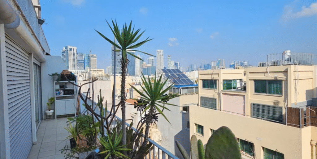 Sun balcony with skyline view in Tel Aviv apartment