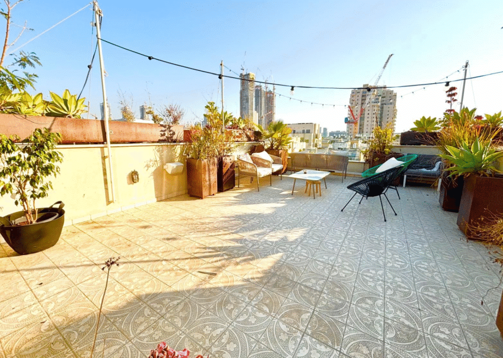 Rooftop terrace with urban skyline views in Tel Aviv penthouse