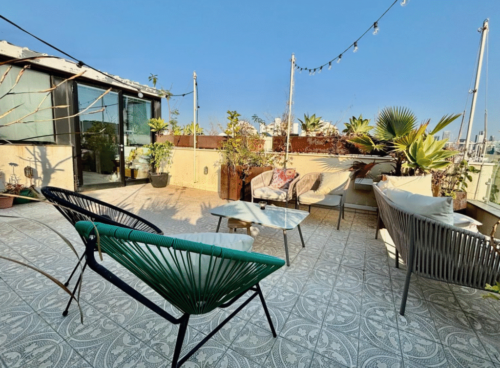Lounge seating area on private rooftop terrace in Tel Aviv