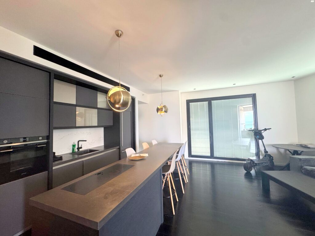 Designer kitchen with breakfast bar in Tel Aviv apartment