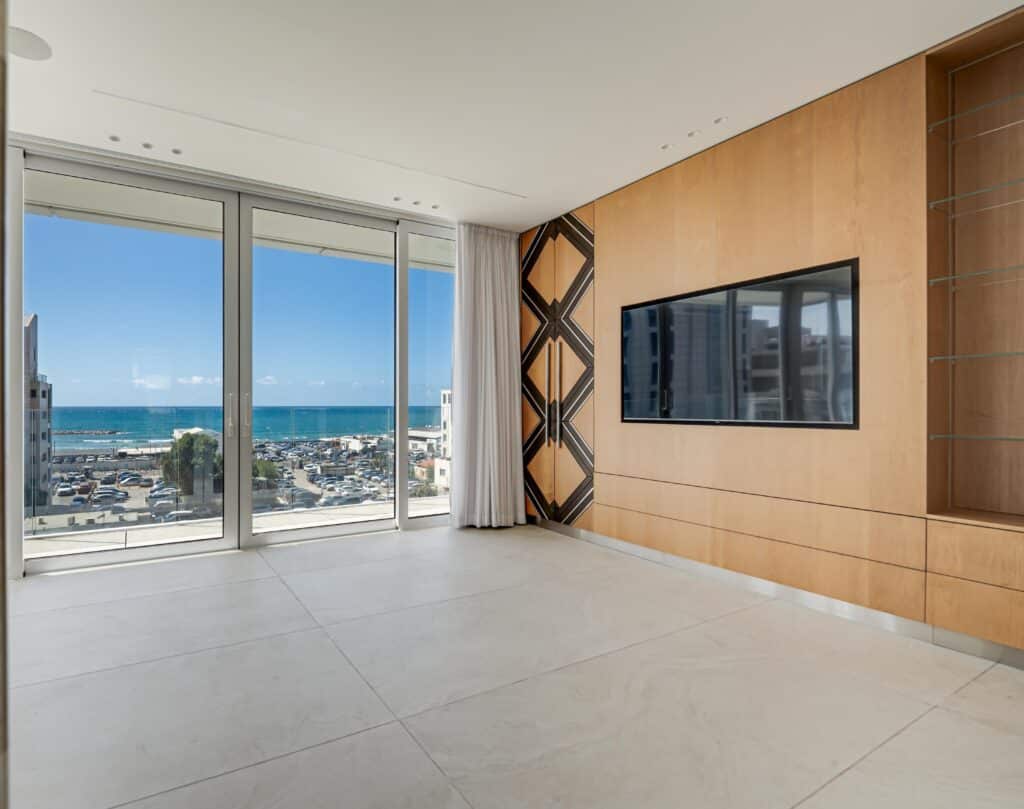 Modern living room with sea view in luxury Tel Aviv apartment