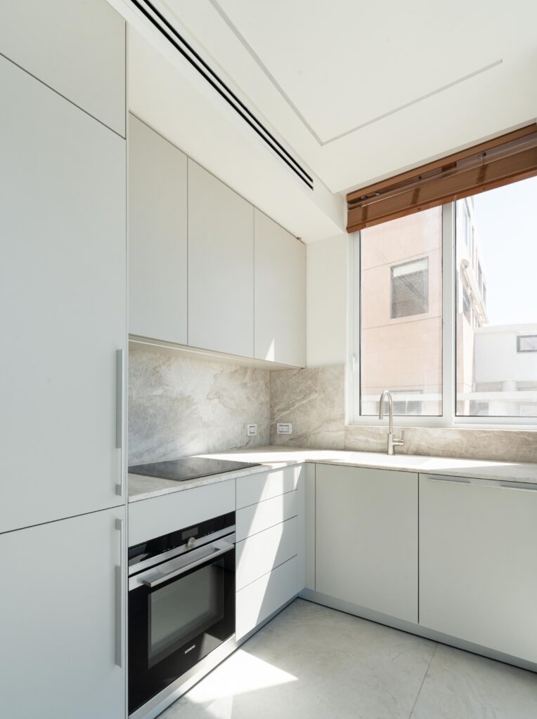 Modern kitchen with marble backsplash and premium appliances