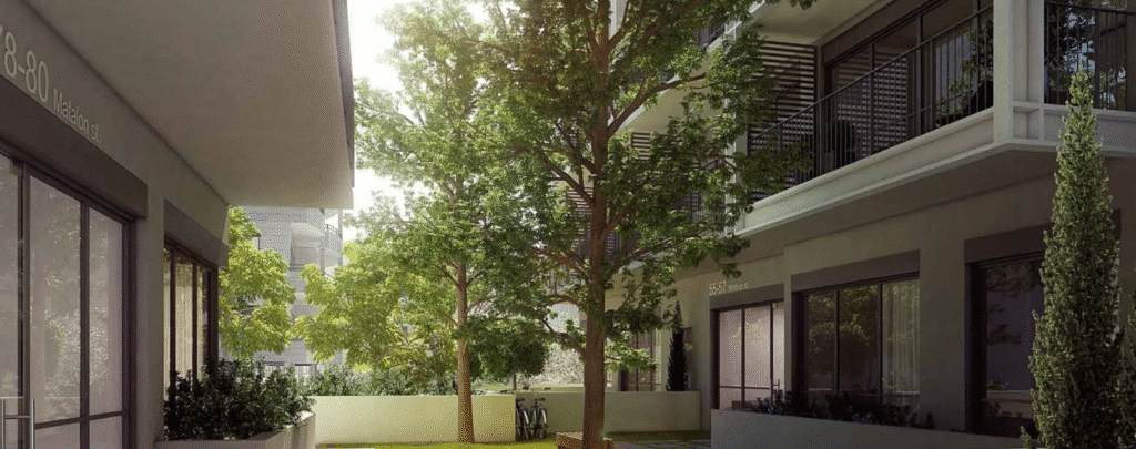 Tree-lined courtyard in new Florentin residential project