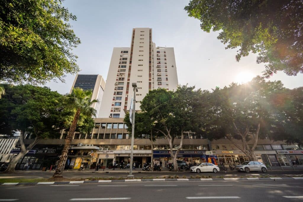 High-rise apartment building in central Tel Aviv with shops below