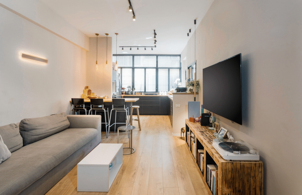 Renovated living room and open kitchen in Tel Aviv apartment