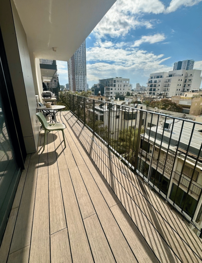 Balcony with city view in modern Tel Aviv apartment