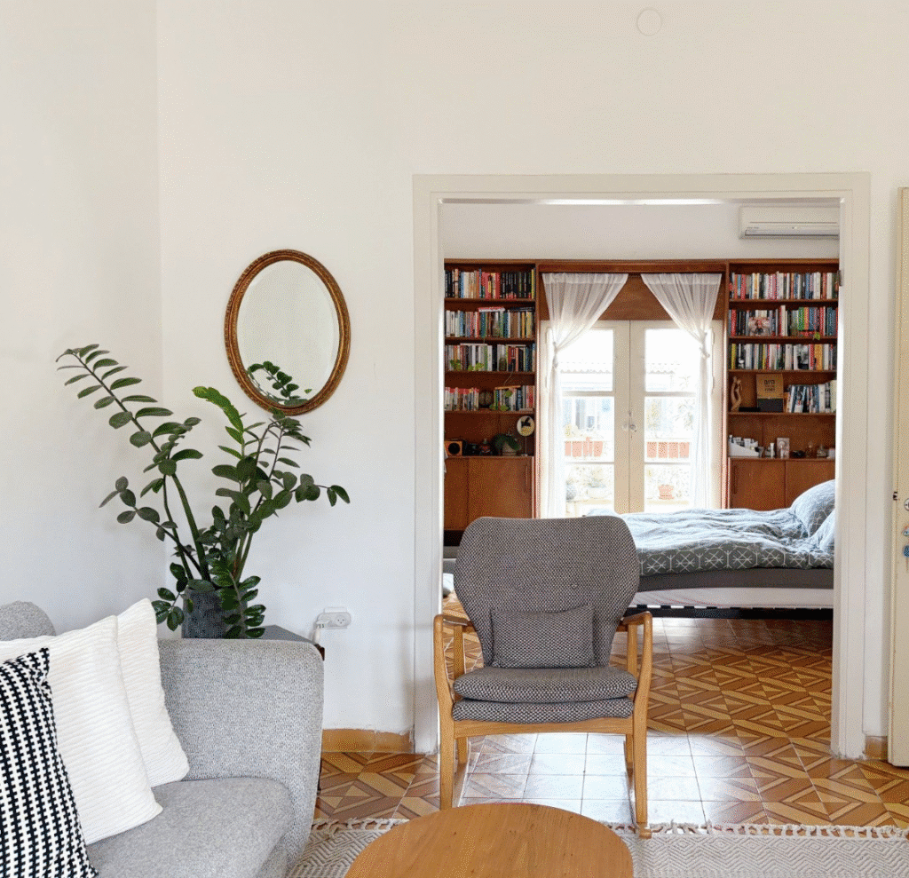 Bedroom with built-in bookshelves and balcony doors
