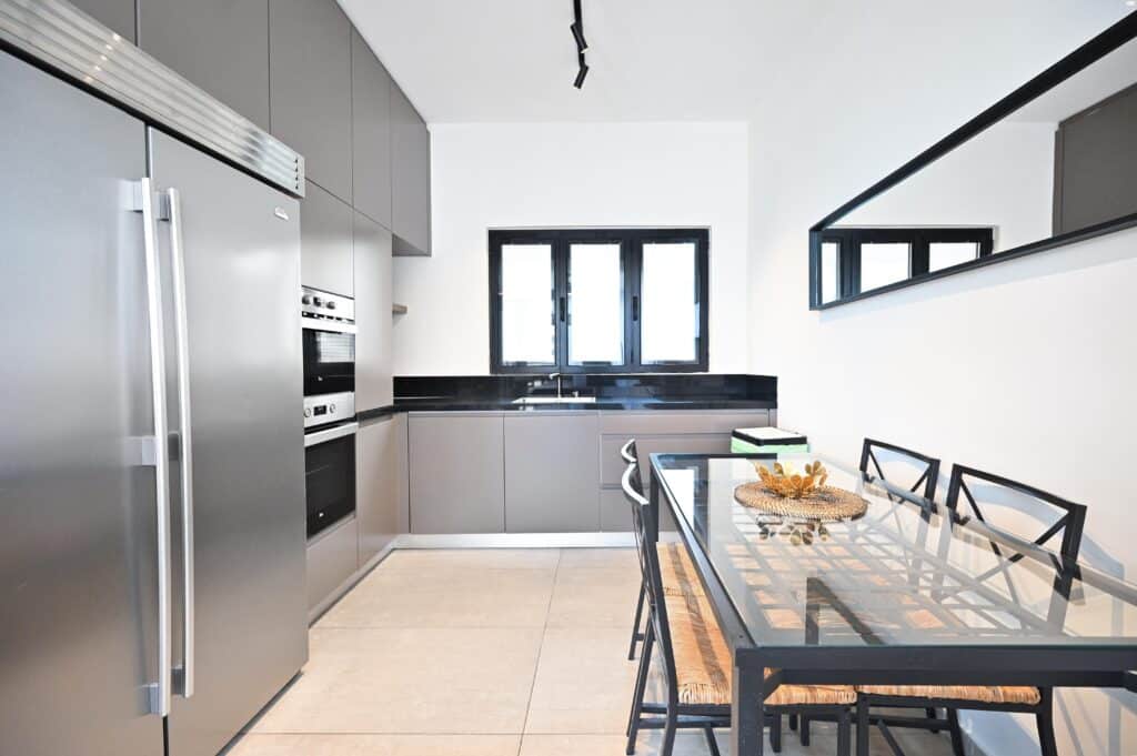 Stylish kitchen and dining area in Tel Aviv luxury property
