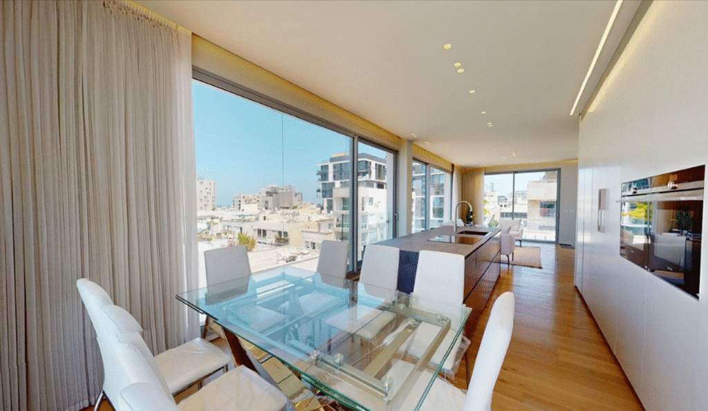 Open-plan dining area and modern kitchen with sea view